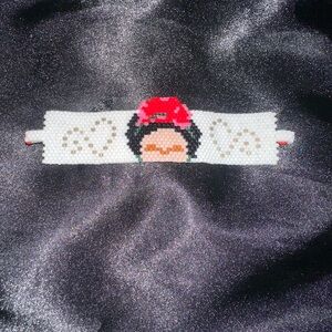 Handmade Beaded Bracelet with Red and White Design